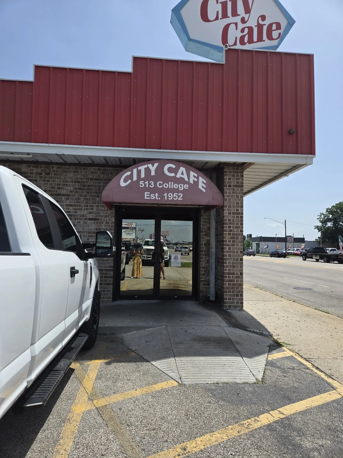 The front entrance of City Cafe at 513 College Ave in South Houston, Texas, with parking out front